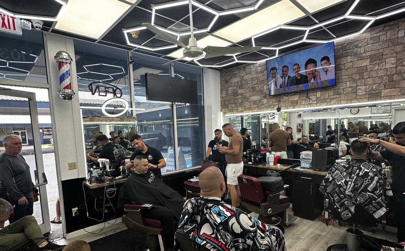 Extremecuts II Barbershop interior — clients in the chairs, The Hammocks